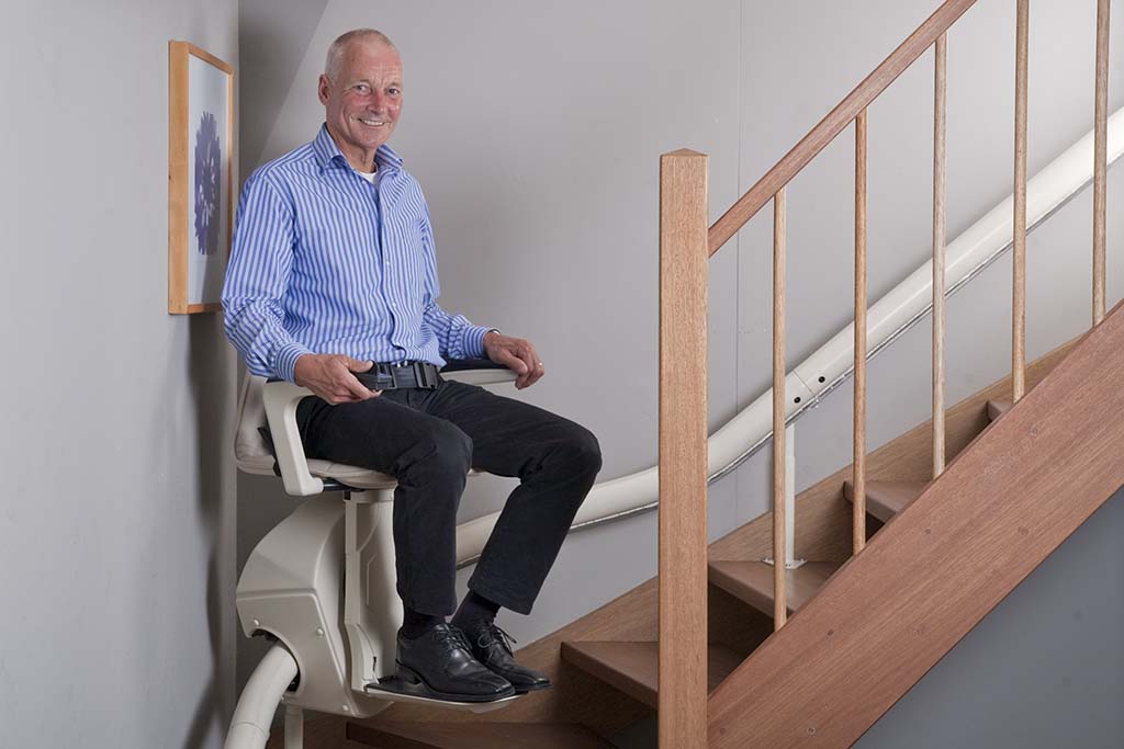 Man using Stairlifts - Stairlifts, Stairlift repairs, stairlift rentals in Cirencester, Newbury, Malmesbury,